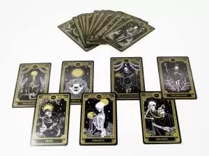 Tarot cards in black, white, and gold