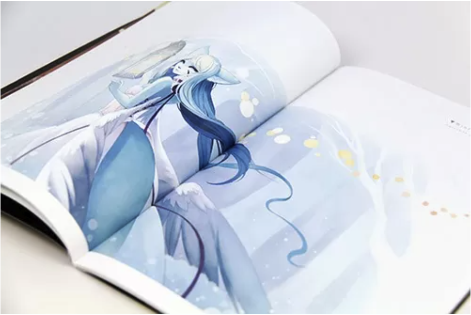 Photograph of an open softcover book with a full-bleed illustration crossing the gutter between two facing pages
