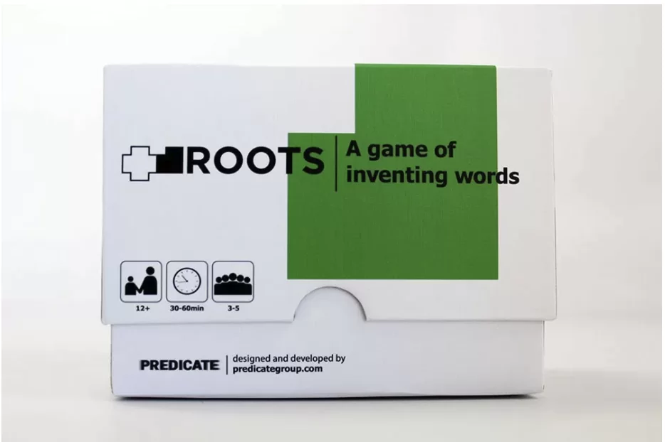 Roots - A Game of Inventing Words - shown in its custom two-piece box with the lid lifted to reveal the cards stacked inside